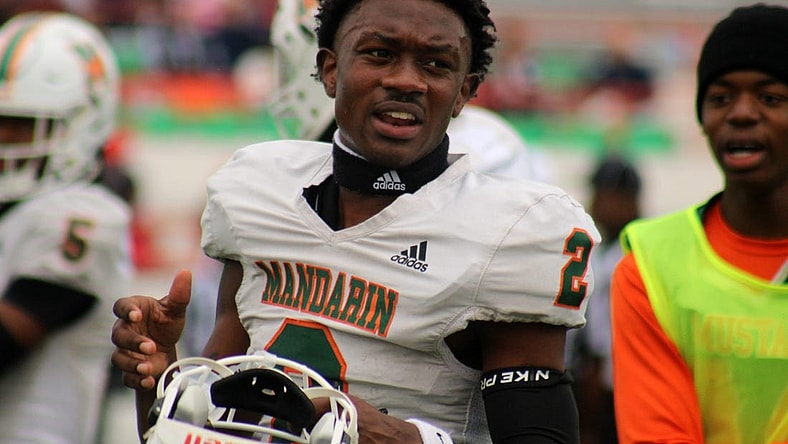Mandarin wide receiver Jaime Ffrench Jr. (2) talks with teammates on the sideline before the FHSAA Class 4M high school football championship game against Miami Columbus on December 8, 2023. [Clayton Freeman/Florida Times-Union]