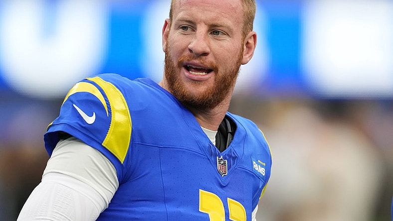 Dec 17, 2023; Inglewood, California, USA; Los Angeles Rams quarterback Carson Wentz (11) reacts during the first half against the Washington Commanders at SoFi Stadium. Mandatory Credit: Kirby Lee-USA TODAY Sports