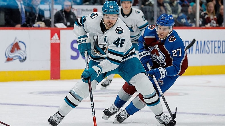 Dec 17, 2023; Denver, Colorado, USA; San Jose Sharks center Tomas Hertl (48) controls the puck ahead of Colorado Avalanche left wing Jonathan Drouin (27) in the third period at Ball Arena. Mandatory Credit: Isaiah J. Downing-USA TODAY Sports