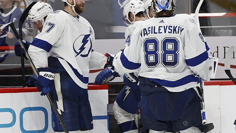 Dec 23, 2023; Washington, District of Columbia, USA; Tampa Bay Lightning goaltender Andrei Vasilevskiy (88) celebrates with Lightning defenseman Victor Hedman (77) after their game against the Washington Capitals at Capital One Arena. Mandatory Credit: Geoff Burke-USA TODAY Sports
