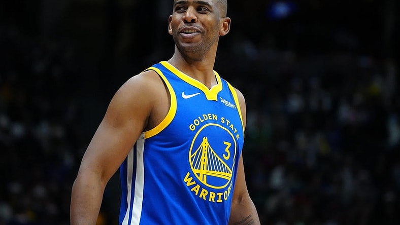 Dec 25, 2023; Denver, Colorado, USA; Golden State Warriors guard Chris Paul (3) reacts back to the Denver Nuggets bench in the third quarter at Ball Arena. Mandatory Credit: Ron Chenoy-USA TODAY Sports