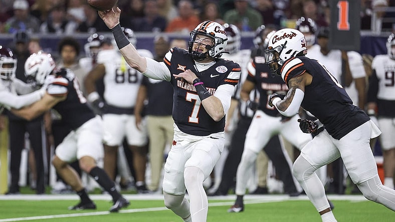 Dec 27, 2023; Houston, TX, USA; Oklahoma State Cowboys quarterback Alan Bowman (7) attempts a pass during the first quarter against the Texas A&M Aggies at NRG Stadium. Mandatory Credit: Troy Taormina-USA TODAY Sports