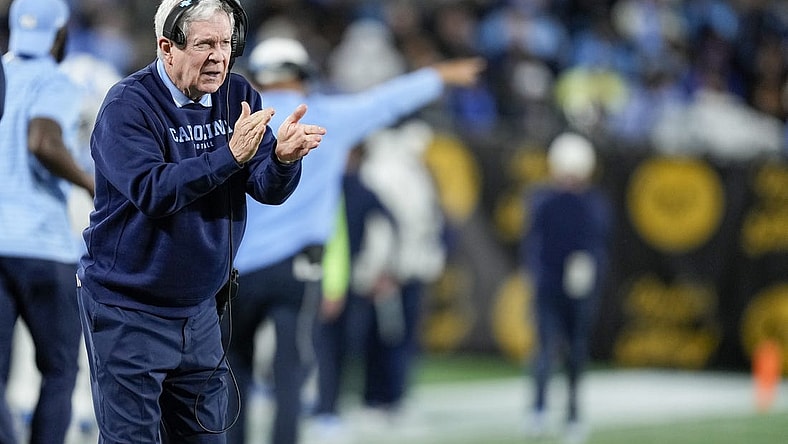 Dec 27, 2023; Charlotte, NC, USA; North Carolina Tar Heels head coach Mack Brown tries to cheer on his defense during the second half against the West Virginia Mountaineers at Bank of America Stadium. Mandatory Credit: Jim Dedmon-USA TODAY Sports