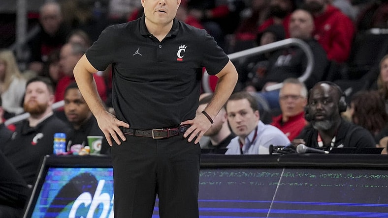 Dec 29, 2023; Cincinnati, Ohio, USA;  Cincinnati Bearcats head coach Wes Miller watches from down court in the game against the Evansville Aces in the first half at Fifth Third Arena. Mandatory Credit: Aaron Doster-USA TODAY Sports