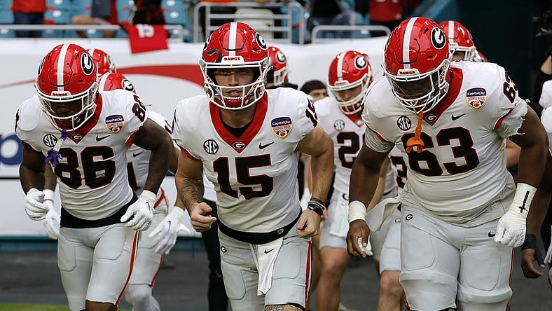 Dec 30, 2023; Miami Gardens, FL, USA; Georgia Bulldogs quarterback Carson Beck (15) leads the team onto the field before the game against the Florida State Seminoles for the 2023 Orange Bowl at Hard Rock Stadium. Mandatory Credit: Sam Navarro-USA TODAY Sports