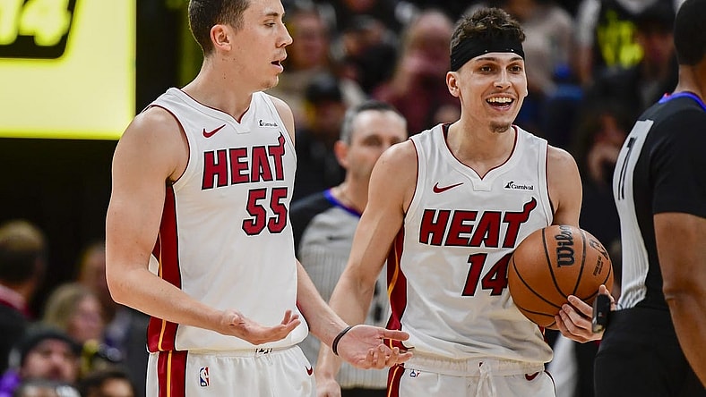 Dec 31, 2022; Salt Lake City, Utah, USA; Miami Heat forward Duncan Robinson (55) and guard Tyler Herro (14) react after a call against the Utah Jazz during the second half at Vivint Arena. Mandatory Credit: Christopher Creveling-USA TODAY Sports