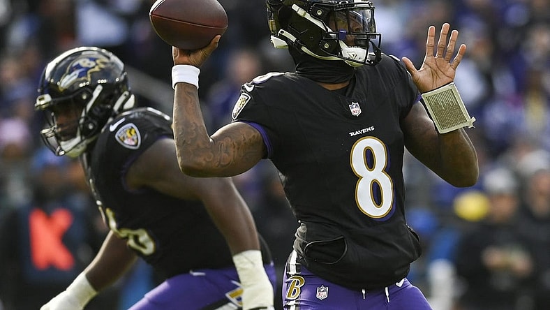 Dec 31, 2023; Baltimore, Maryland, USA; Baltimore Ravens quarterback Lamar Jackson (8) throws during the  during the first quarter against the Miami Dolphins at M&T Bank Stadium. Mandatory Credit: Tommy Gilligan-USA TODAY Sports