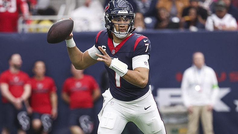 Dec 31, 2023; Houston, Texas, USA; Houston Texans quarterback C.J. Stroud (7) attempts a pass during the third quarter against the Tennessee Titans at NRG Stadium. Mandatory Credit: Troy Taormina-USA TODAY Sports