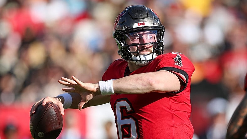 Dec 31, 2023; Tampa, Florida, USA;  Tampa Bay Buccaneers quarterback Baker Mayfield (6) drops back to pass against the New Orleans Saints in the fourth quarter at Raymond James Stadium. Mandatory Credit: Nathan Ray Seebeck-USA TODAY Sports