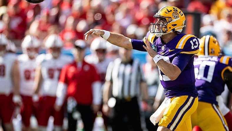 Jan 1, 2024; Tampa, FL, USA; LSU Tigers quarterback Garrett Nussmeier (13) throws the ball during the first half against the Wisconsin Badgers at Raymond James Stadium. Mandatory Credit: Matt Pendleton-USA TODAY Sports
