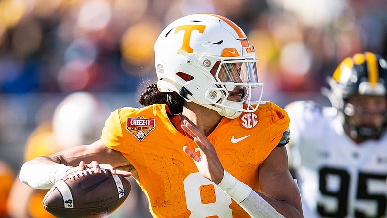 Jan 1, 2024; Orlando, FL, USA; Tennessee Volunteers quarterback Nico Iamaleava (8) throws the ball against the Iowa Hawkeyes in the second quarter at Camping World Stadium. Mandatory Credit: Jeremy Reper-USA TODAY Sports