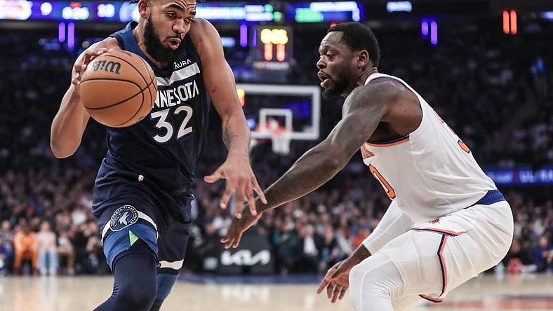 Jan 1, 2024; New York, New York, USA;  Minnesota Timberwolves center Karl-Anthony Towns (32) looks to drive past New York Knicks forward Julius Randle (30) in the first quarter at Madison Square Garden. Mandatory Credit: Wendell Cruz-USA TODAY Sports