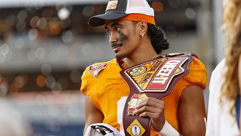 Jan 1, 2024; Orlando, FL, USA; Tennessee Volunteers quarterback Nico Iamaleava (8) poses with the MVP Trophy after defeating the Iowa Hawkeyes at Camping World Stadium. Mandatory Credit: Morgan Tencza-USA TODAY Sports