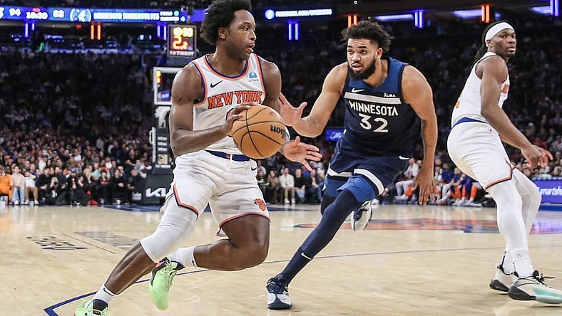 Jan 1, 2024; New York, New York, USA;  New York Knicks forward OG Anunoby (8) looks to drive past Minnesota Timberwolves center Karl-Anthony Towns (32) in the fourth quarter at Madison Square Garden. Mandatory Credit: Wendell Cruz-USA TODAY Sports