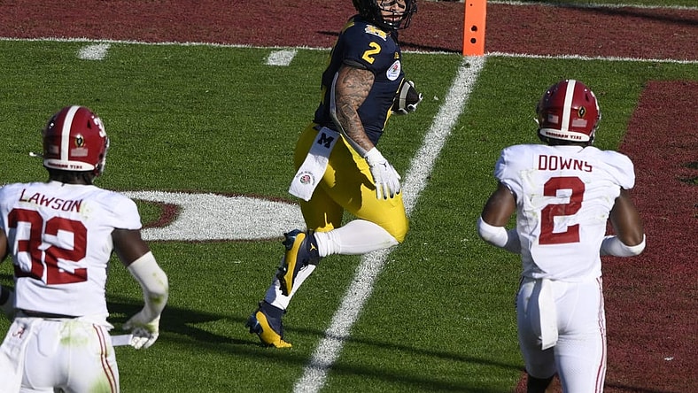 Jan 1, 2024; Pasadena, CA, USA; Michigan Wolverines running back Blake Corum (2) scores a touchdown past Alabama Crimson Tide linebacker Deontae Lawson (32) and defensive back Caleb Downs (2) in the 2nd quarter of the 2024 Rose Bowl college football playoff semifinal game at Rose Bowl. Mandatory Credit: Robert Hanashiro-USA TODAY Sports
