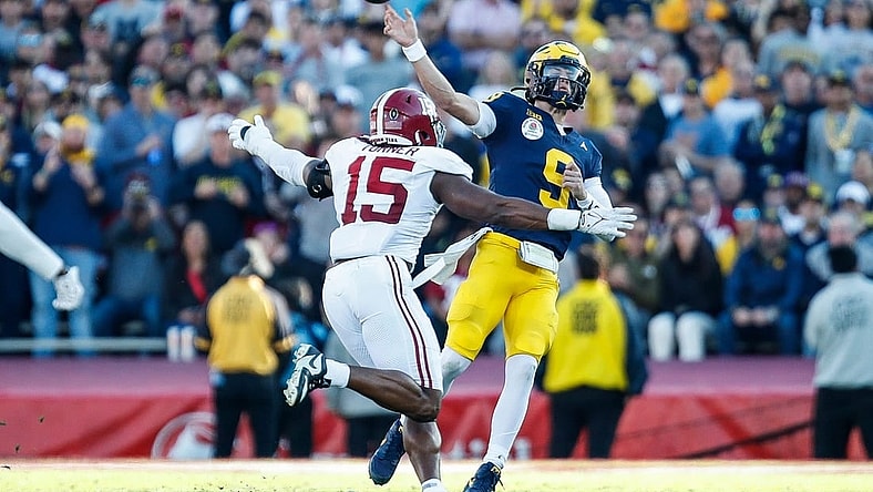 Michigan quarterback J.J. McCarthy makes a pass against Alabama linebacker Dallas Turner during the first half of the Rose Bowl in Pasadena, California, on Monday, Jan. 1, 2024.
