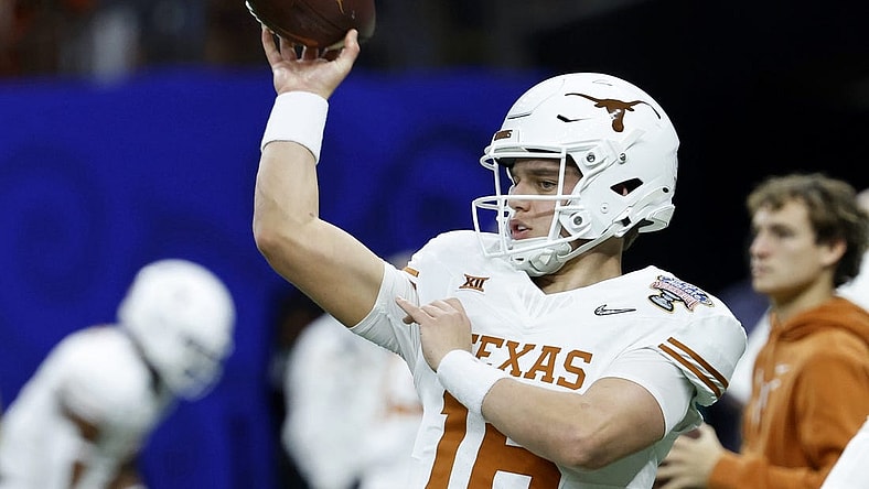 Jan 1, 2024; New Orleans, LA, USA; Texas Longhorns quarterback Arch Manning (16) warms up before the 2024 Sugar Bowl college football playoff semifinal game against the Washington Huskies at Caesars Superdome. Mandatory Credit: Geoff Burke-USA TODAY Sports
