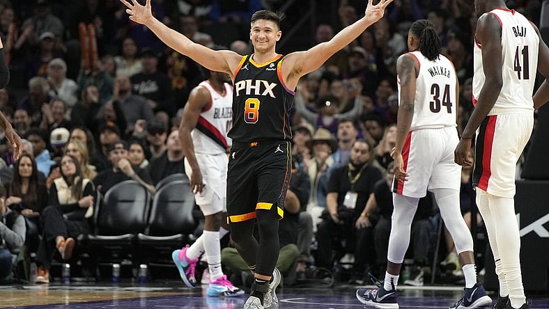 Jan 1, 2024; Phoenix, Arizona, USA; Phoenix Suns guard Grayson Allen (8) reacts after guard Devin Booker (1) makes a basket against the Portland Trail Blazers in the second half at Footprint Center. Mandatory Credit: Rick Scuteri-USA TODAY Sports