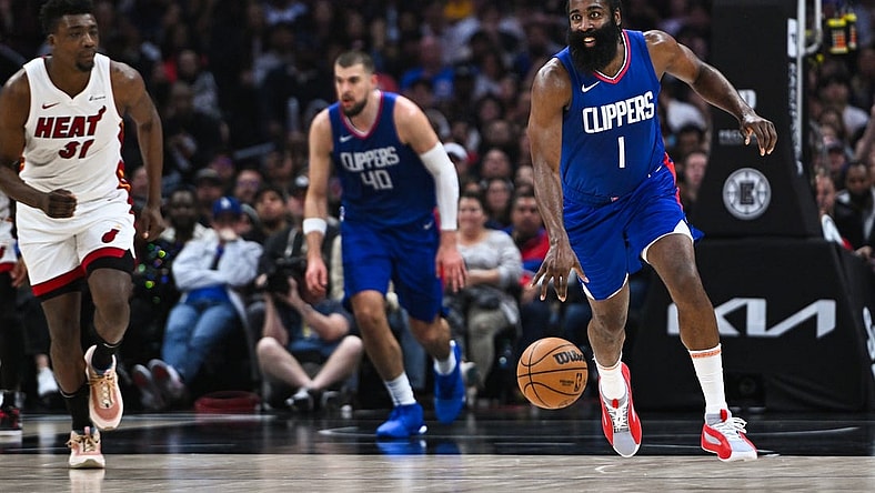 Jan 1, 2024; Los Angeles, California, USA; Los Angeles Clippers guard James Harden (1) moves the ball against Miami Heat center Thomas Bryant (31) during the second quarter at Crypto.com Arena. Mandatory Credit: Jonathan Hui-USA TODAY Sports