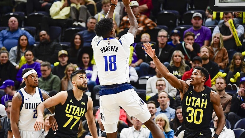 Jan 1, 2024; Salt Lake City, Utah, USA; Dallas Mavericks forward Olivier-Maxence Prosper (18) shoots over Utah Jazz guard Ochai Agbaji (30) during the second half at the Delta Center. Mandatory Credit: Christopher Creveling-USA TODAY Sports