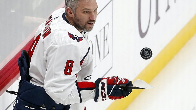 Jan 2, 2024; Pittsburgh, Pennsylvania, USA;  Washington Capitals left wing Alex Ovechkin (8) juggles the puck to warm up before the game against the Pittsburgh Penguins at PPG Paints Arena. Mandatory Credit: Charles LeClaire-USA TODAY Sports