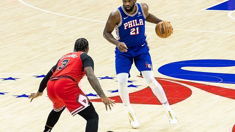 Jan 2, 2024; Philadelphia, Pennsylvania, USA; Philadelphia 76ers center Joel Embiid (21) controls the ball against Chicago Bulls center Andre Drummond (3) during the third quarter at Wells Fargo Center. Mandatory Credit: Bill Streicher-USA TODAY Sports