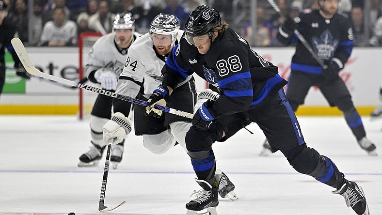 Jan 2, 2024; Los Angeles, California, USA; Toronto Maple Leafs right wing William Nylander (88) skates the puck past Los Angeles Kings defenseman Vladislav Gavrikov (84) in the first period at Crypto.com Arena. Mandatory Credit: Jayne Kamin-Oncea-USA TODAY Sports