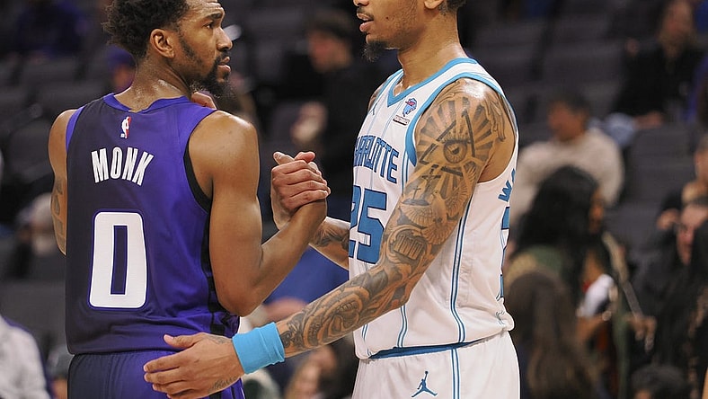 Jan 2, 2024; Sacramento, California, USA; Sacramento Kings guard Malik Monk (0) and Charlotte Hornets forward P.J. Washington Jr. (25) shake hands after the game at Golden 1 Center. Mandatory Credit: Kelley L Cox-USA TODAY Sports