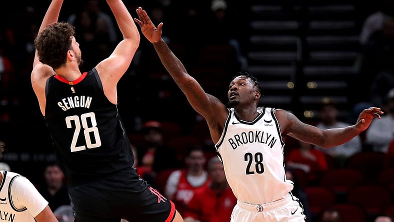 Jan 3, 2024; Houston, Texas, USA; Houston Rockets center Alperen Sengun (28) shoots against Brooklyn Nets forward Dorian Finney-Smith (28) during the first quarter at Toyota Center. Mandatory Credit: Erik Williams-USA TODAY Sports