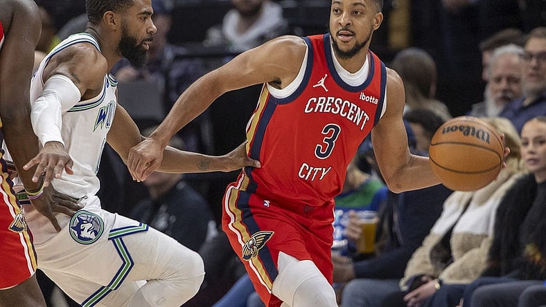 Jan 3, 2024; Minneapolis, Minnesota, USA; New Orleans Pelicans guard CJ McCollum (3) looks to pass the ball around Minnesota Timberwolves guard Mike Conley (10) in the first half at Target Center. Mandatory Credit: Jesse Johnson-USA TODAY Sports
