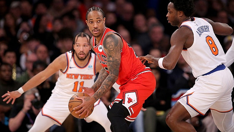Jan 3, 2024; New York, New York, USA; Chicago Bulls forward DeMar DeRozan (11) controls the ball against New York Knicks guard Jalen Brunson (11) and forward OG Anunoby (8) during the second quarter at Madison Square Garden. Mandatory Credit: Brad Penner-USA TODAY Sports