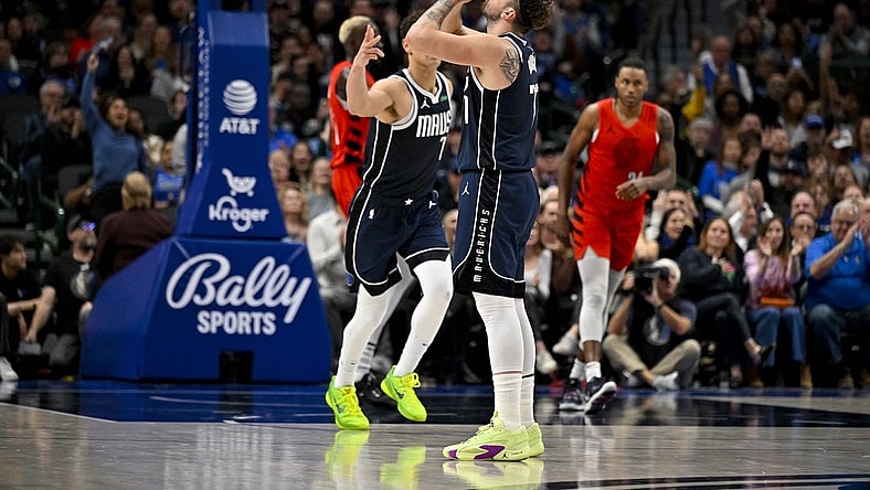 Jan 3, 2024; Dallas, Texas, USA; Dallas Mavericks guard Luka Doncic (77) celebrates after making a three point basket against the Portland Trail Blazers during the second quarter at the American Airlines Center. Mandatory Credit: Jerome Miron-USA TODAY Sports