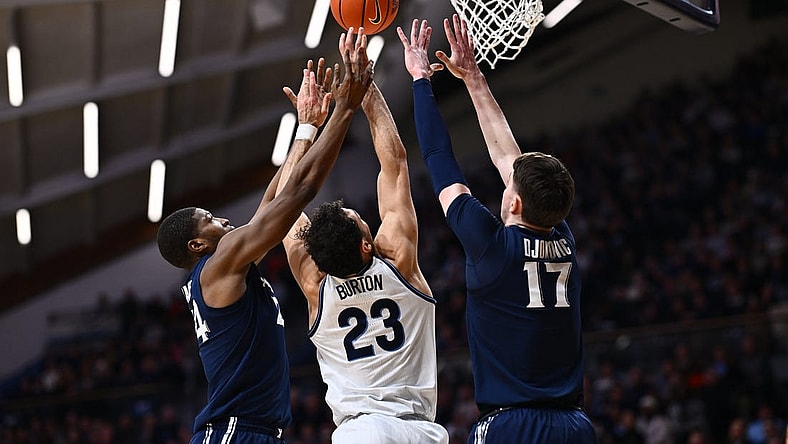 Jan 3, 2024; Villanova, Pennsylvania, USA; Villanova Wildcats forward Tyler Burton (23) reaches for a rebound between Xavier Musketeers forward Abou Ousmane (24) and forward Lazar Djokovic (17) in the first half at William B. Finneran Pavilion. Mandatory Credit: Kyle Ross-USA TODAY Sports