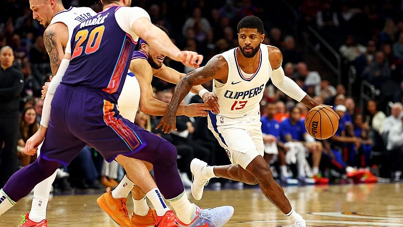 Jan 3, 2024; Phoenix, Arizona, USA; LA Clippers forward Paul George (13) drives to the basket during the second quarter against the Phoenix Suns at Footprint Center. Mandatory Credit: Mark J. Rebilas-USA TODAY Sports