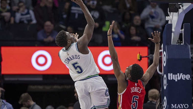 Jan 3, 2024; Minneapolis, Minnesota, USA; Minnesota Timberwolves guard Anthony Edwards (5) shoots the ball over New Orleans Pelicans forward Herbert Jones (5) in the second half at Target Center. Mandatory Credit: Jesse Johnson-USA TODAY Sports
