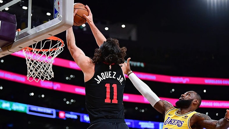 Jan 3, 2024; Los Angeles, California, USA; Miami Heat guard Jaime Jaquez Jr. (11) moves to the basket against Los Angeles Lakers forward LeBron James (23) during the first half at Crypto.com Arena. Mandatory Credit: Gary A. Vasquez-USA TODAY Sports