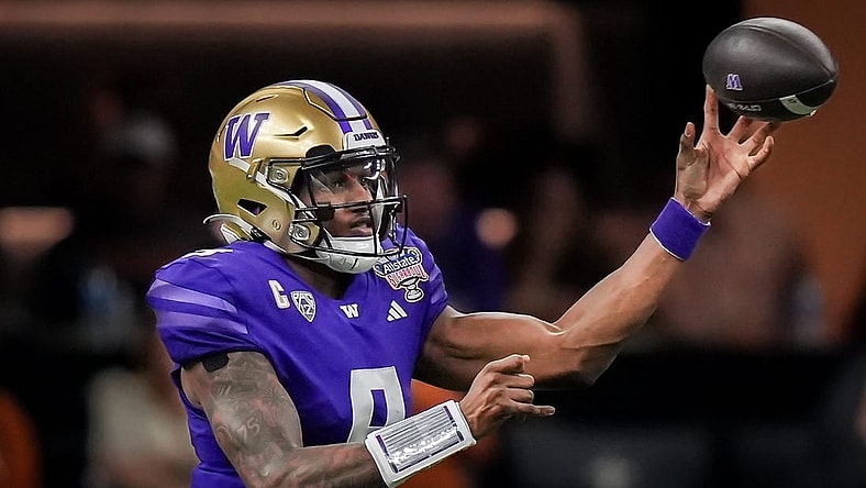 Washington Huskies quarterback Michael Penix Jr. (9) pass the ball during the Sugar Bowl College Football Playoff semi-finals at the Ceasars Superdome in New Orleans, Louisiana, Jan. 1, 2024. The Huskies won the game over the Texas Longhorns 37-31.