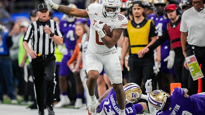 Texas Longhorns tight end Ja'Tavion Sanders (0) evades the Washington Huskies defense during the Sugar Bowl College Football Playoff semi-finals at the Ceasars Superdome in New Orleans, Louisiana, Jan. 1, 2024. The Huskies won the game over the Texas Longhorns 37-31.