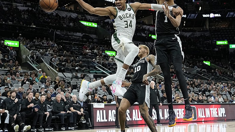 Jan 4, 2024; San Antonio, Texas, USA; Milwaukee Bucks forward Giannis Antetokounmpo (34) loses control of the ball while driving to the basket against San Antonio Spurs forward Victor Wembanyama (1) during the first half at Frost Bank Center. Mandatory Credit: Scott Wachter-USA TODAY Sports