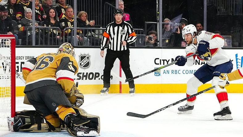 Jan 4, 2024; Las Vegas, Nevada, USA; Florida Panthers center Kevin Stenlund (82) shoots against Vegas Golden Knights goaltender Logan Thompson (36) during the first period at T-Mobile Arena. Mandatory Credit: Stephen R. Sylvanie-USA TODAY Sports
