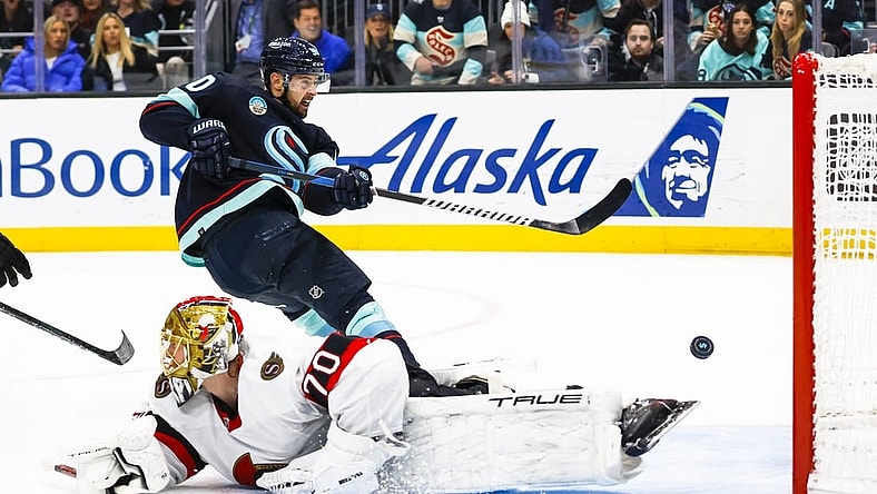 Jan 4, 2024; Seattle, Washington, USA; Seattle Kraken left wing Tomas Tatar (90) scores a goal against Ottawa Senators goaltender Joonas Korpisalo (70) during the second period at Climate Pledge Arena. Mandatory Credit: Joe Nicholson-USA TODAY Sports