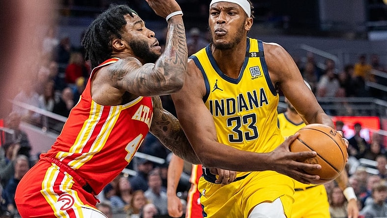 Jan 5, 2024; Indianapolis, Indiana, USA; Indiana Pacers center Myles Turner (33) drives to the basket while Atlanta Hawks forward Saddiq Bey (41) defends in the first quarter at Gainbridge Fieldhouse. Mandatory Credit: Trevor Ruszkowski-USA TODAY Sports