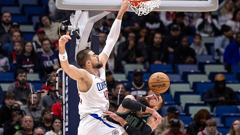 Jan 5, 2024; New Orleans, Louisiana, USA;  LA Clippers center Ivica Zubac (40) dunks the ball against New Orleans Pelicans center Jonas Valanciunas (17) during the first half at Smoothie King Center. Mandatory Credit: Stephen Lew-USA TODAY Sports