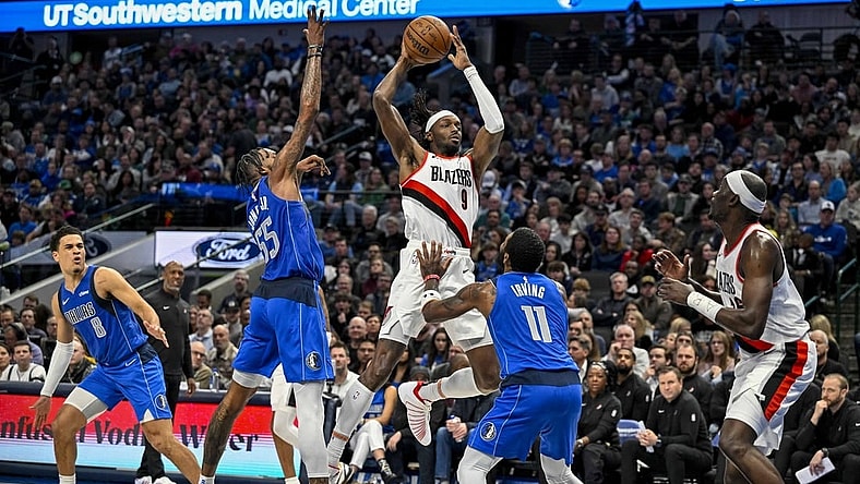 Jan 5, 2024; Dallas, Texas, USA; Portland Trail Blazers forward Jerami Grant (9) passes the ball over Dallas Mavericks forward Derrick Jones Jr. (55) and guard Kyrie Irving (11) during the second quarter at the American Airlines Center. Mandatory Credit: Jerome Miron-USA TODAY Sports