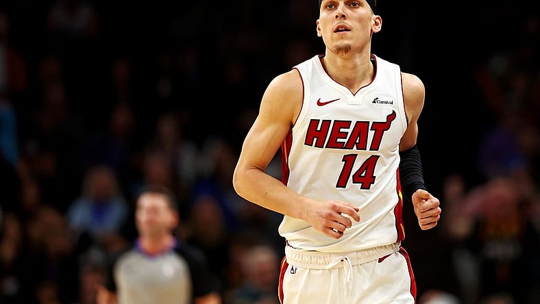 Jan 5, 2024; Phoenix, Arizona, USA; Miami Heat guard Tyler Herro (14) reacts after a play during the third quarter of the game against the Phoenix Suns at Footprint Center. Mandatory Credit: Mark J. Rebilas-USA TODAY Sports