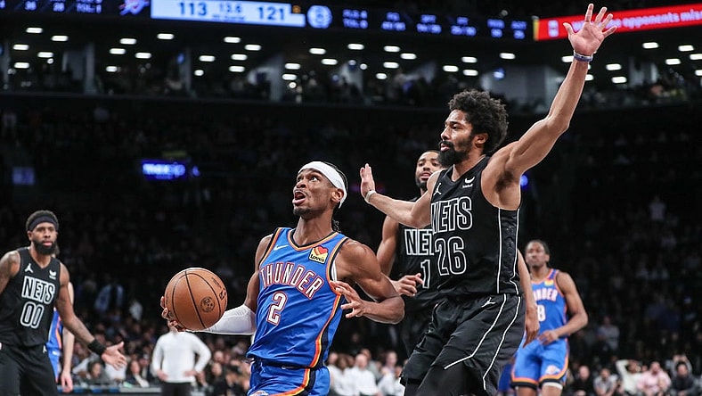 Jan 5, 2024; Brooklyn, New York, USA;  Oklahoma City Thunder guard Shai Gilgeous-Alexander (2) drives past Brooklyn Nets guard Spencer Dinwiddie (26) in the fourth quarter at Barclays Center. Mandatory Credit: Wendell Cruz-USA TODAY Sports