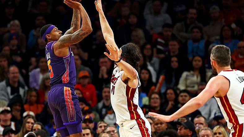 Jan 5, 2024; Phoenix, Arizona, USA; Phoenix Suns guard Bradley Beal (3) shoots the ball against Miami Heat guard Jaime Jaquez Jr. (11) during the fourth quarter at Footprint Center. Mandatory Credit: Mark J. Rebilas-USA TODAY Sports
