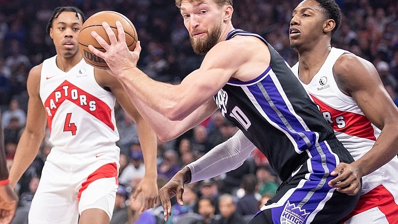 Jan 5, 2024; Sacramento, California, USA; Sacramento Kings forward Domantas Sabonis (10) controls the ball against the Toronto Raptors during the first quarter at Golden 1 Center. Mandatory Credit: Ed Szczepanski-USA TODAY Sports