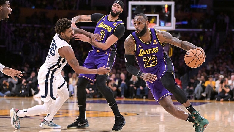 Jan 5, 2024; Los Angeles, California, USA; Los Angeles Lakers forward Anthony Davis (3) screens Memphis Grizzlies guard Marcus Smart (36) as forward LeBron James (23) drives down court in the first half at Crypto.com Arena. Mandatory Credit: Jayne Kamin-Oncea-USA TODAY Sports
