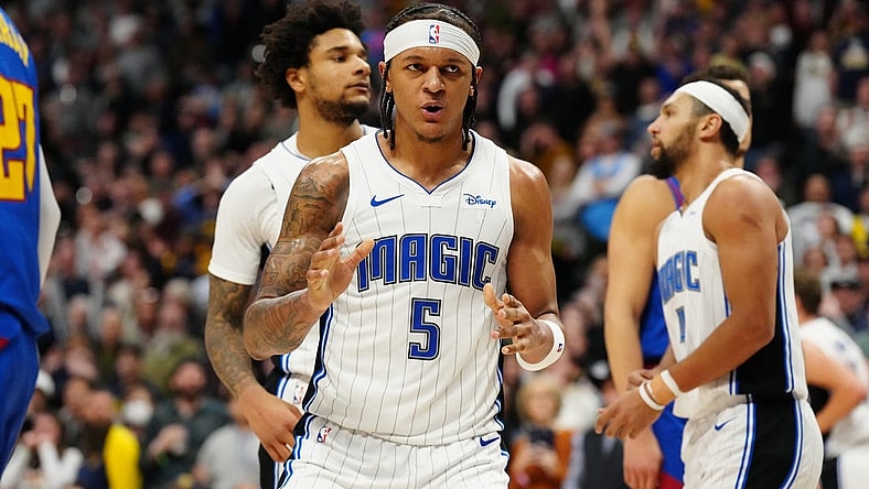 Jan 5, 2024; Denver, Colorado, USA; Orlando Magic forward Paolo Banchero (5) reacts in the fourth quarter against the Denver Nuggets at Ball Arena. Mandatory Credit: Ron Chenoy-USA TODAY Sports